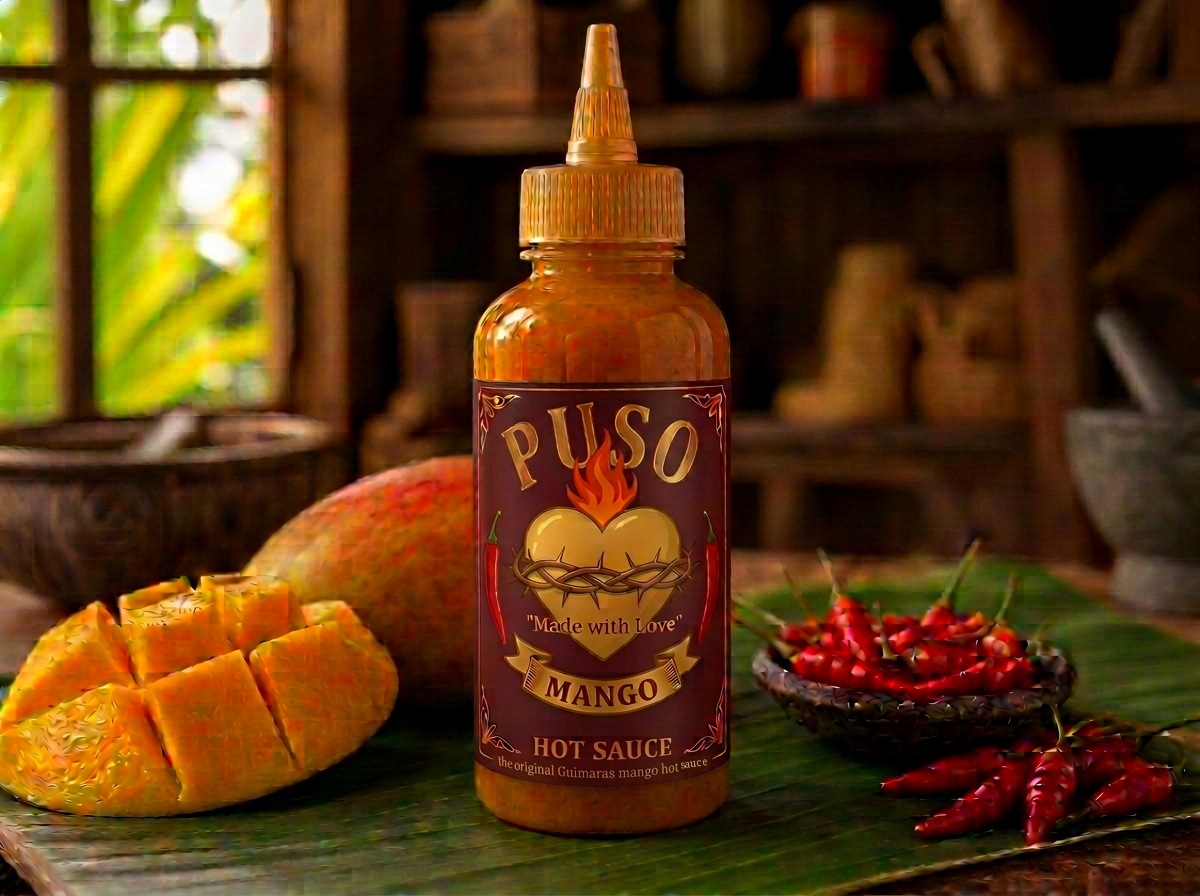 Mango Hot Sauce with a full-colour flaming heart emblem, fresh mango and red chilies